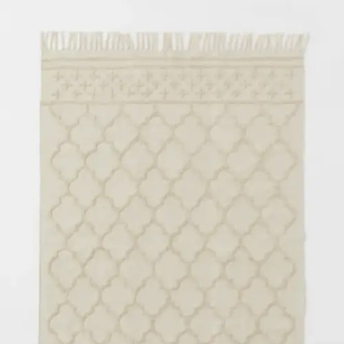 H&M home - tapis en coton avec pompons 